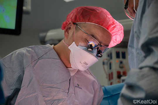 orthopaedic surgeon looking through magnifying loupes